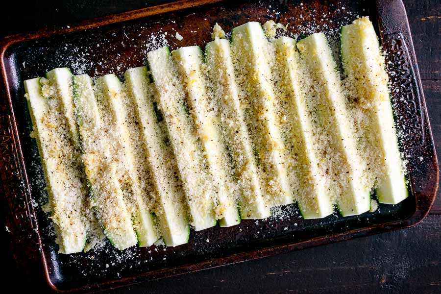 Zucchini wedges coated in parmesan cheese mixture
