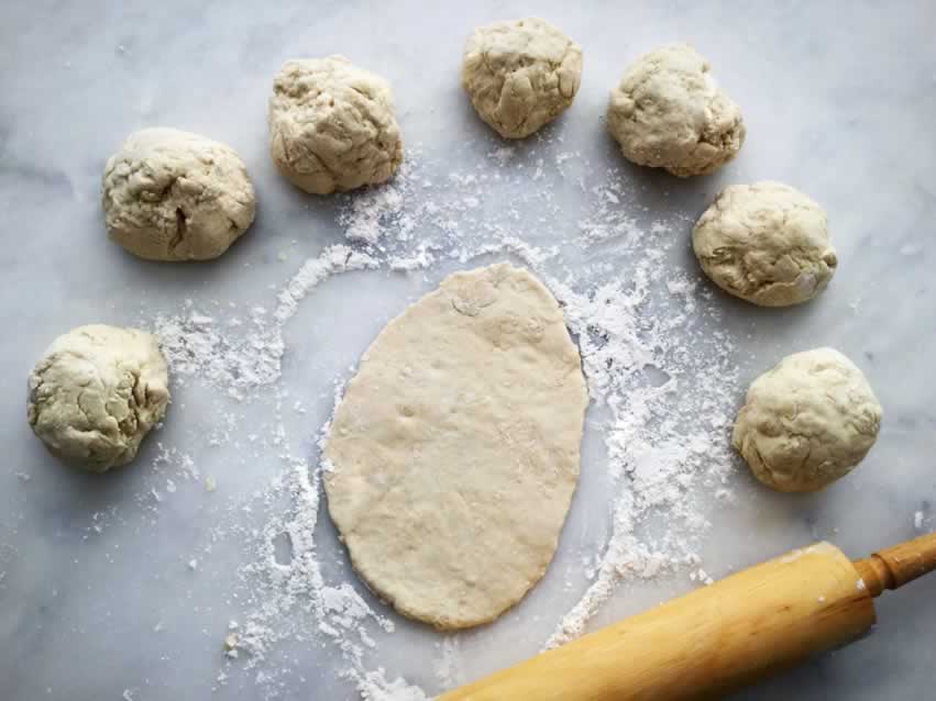 Naan bread dough and rolling pin