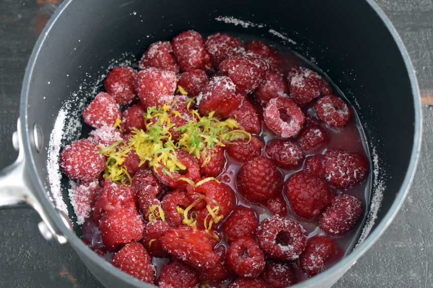 Simmering the raspberries, sugar, Key lime zest, and Key lime juice