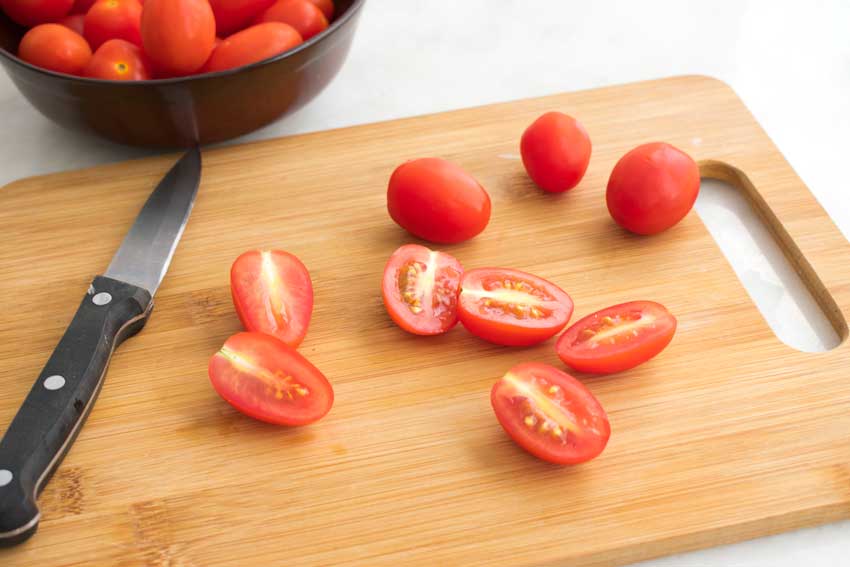 Halving the grape tomatoes