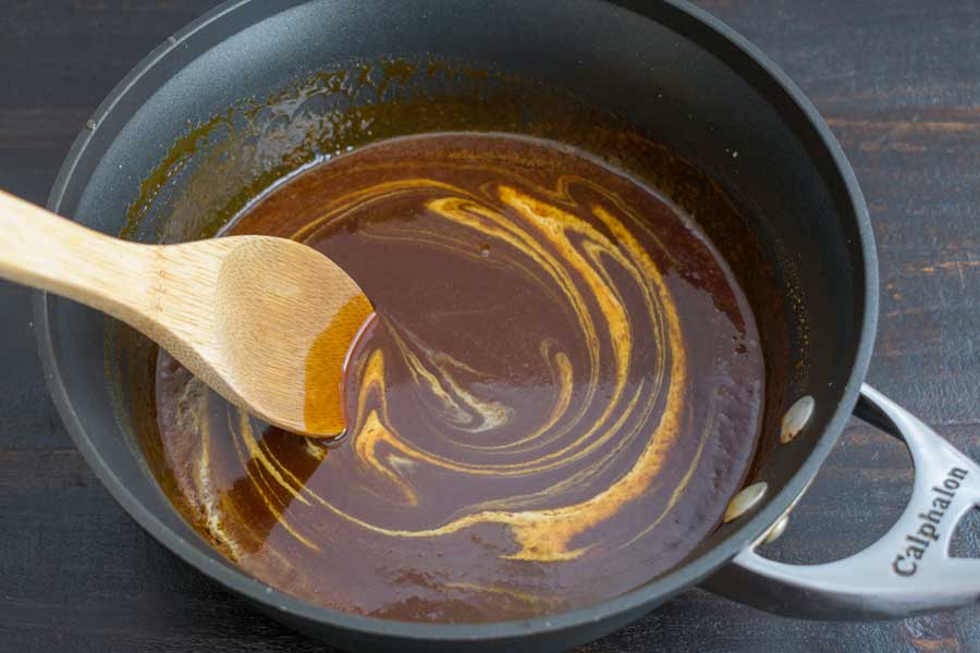 Stirring the cream into the caramel sauce
