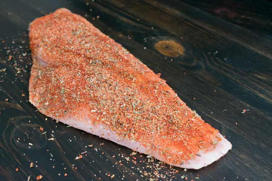 Red snapper fillet rubbed with spice mixture