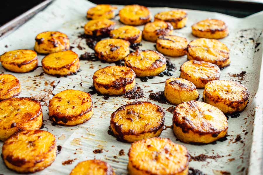 The finished plantains on a parchment-lined sheet pan