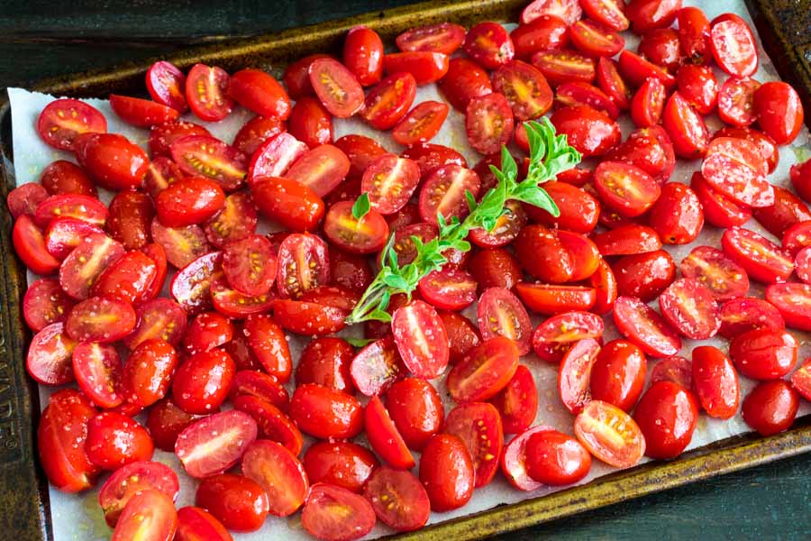 Grape tomatoes and oregano before roasting