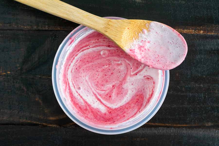 Mixing the raspberry puree with the half-and-half