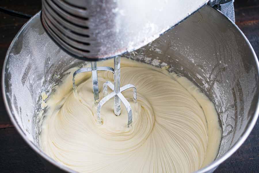 Mixing up the white chocolate frosting in a stand mixer