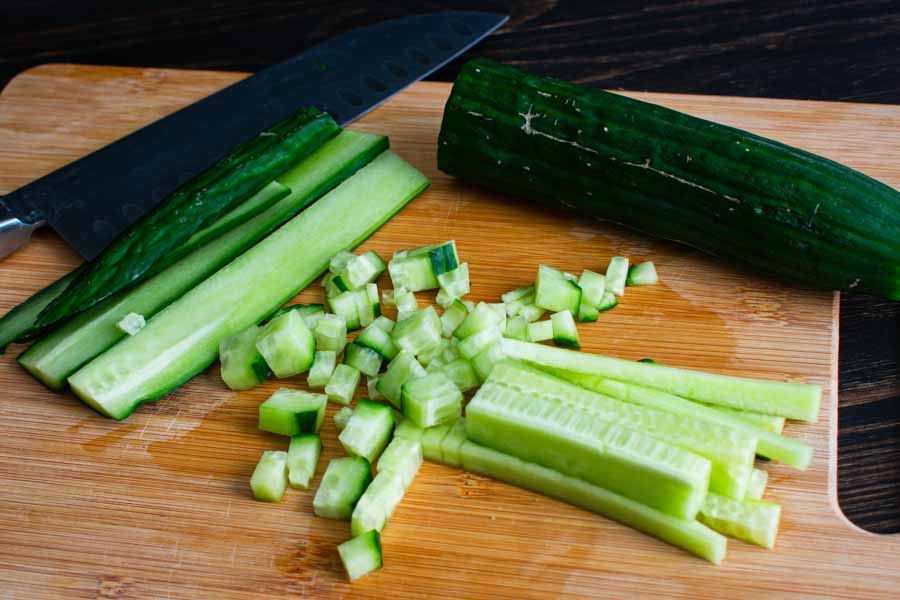 Finely chopping the English cucumber for the tzatziki sauce
