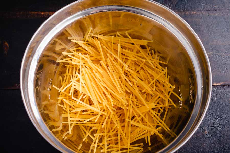 Spaghetti noodles broken into smaller pieces before cooking