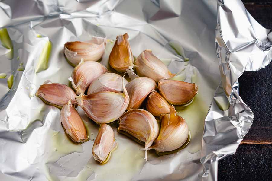 Garlic cloves drizzled in olive oil