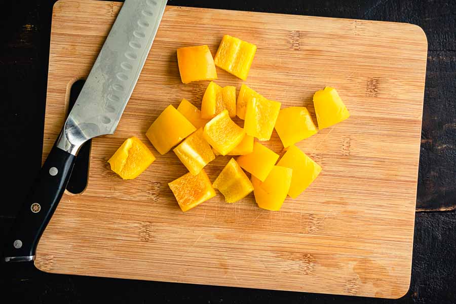 Cutting the yellow pepper into large chunks