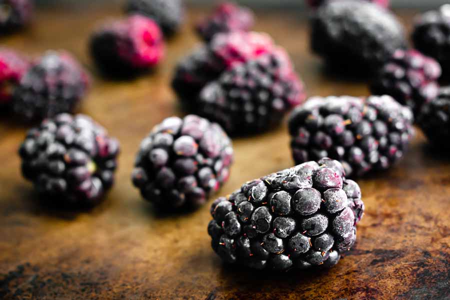 Frozen blackberries to keep the tea cold without watering it down