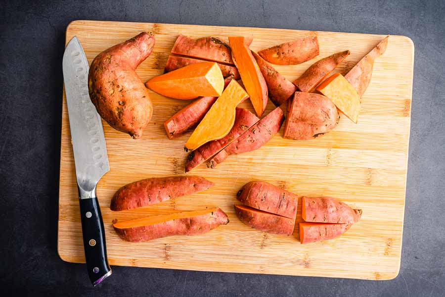 Slicing the sweet potatoes into eighths