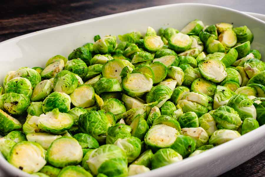 Halved Brussels sprouts tossed with olive oil, salt, and pepper