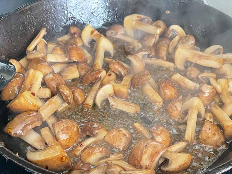 Cooking the mushrooms in the same cast iron skillet I cooked the steak tips in
