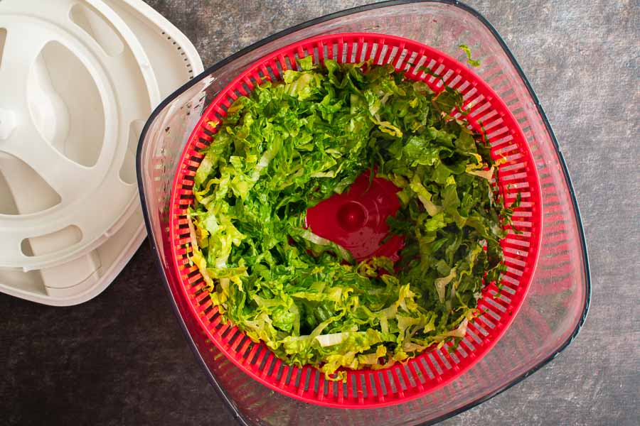 Sliced romaine lettuce in a salad spinner