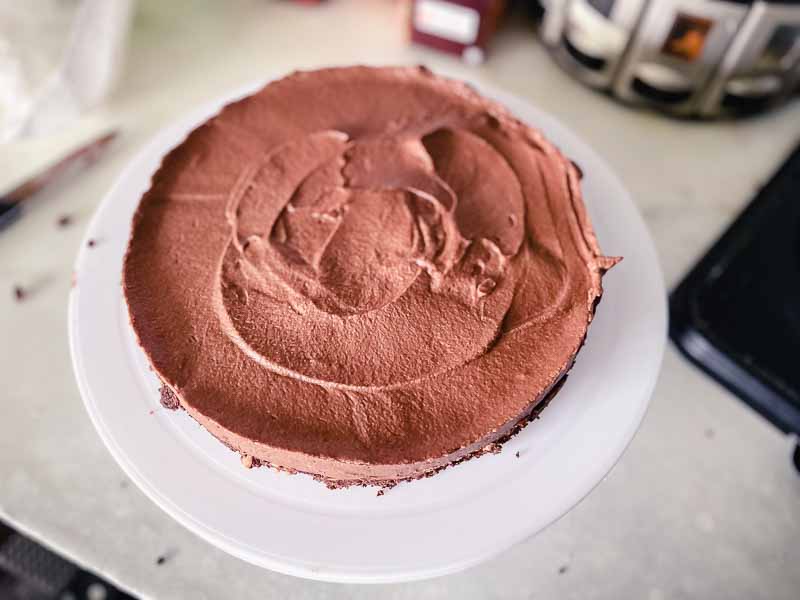 Chocolate Hazelnut Mousse Cake on a rotating cake stand