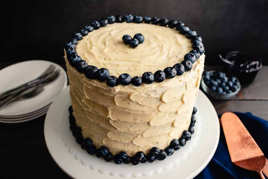 Decorated and unsliced Blueberry Cobbler Cake