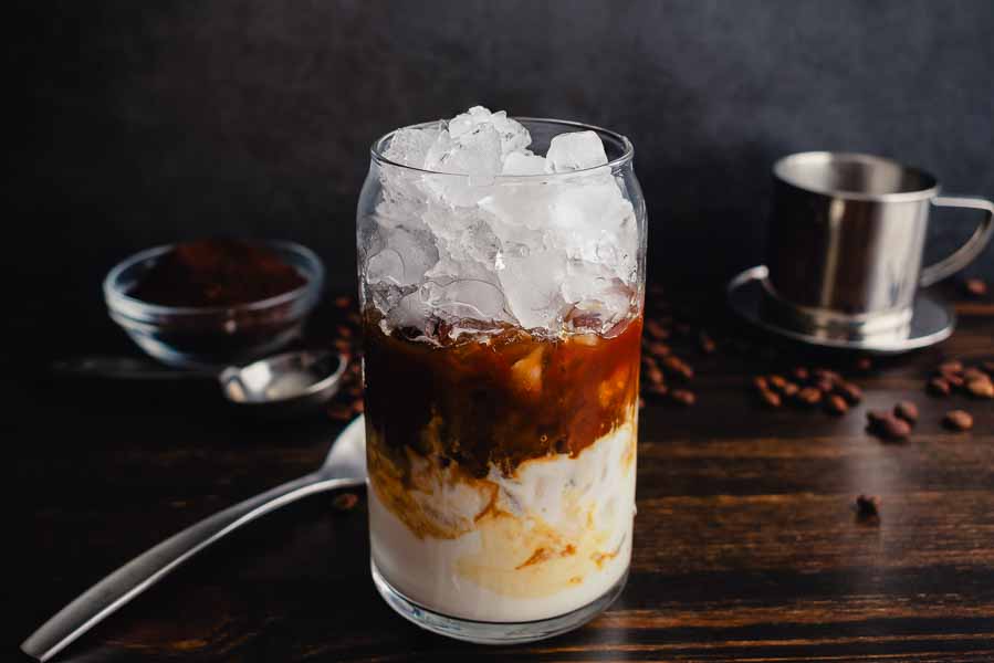 Crushed ice and coffee layered over a mixture of plain Greek yogurt and sweetened condensed milk